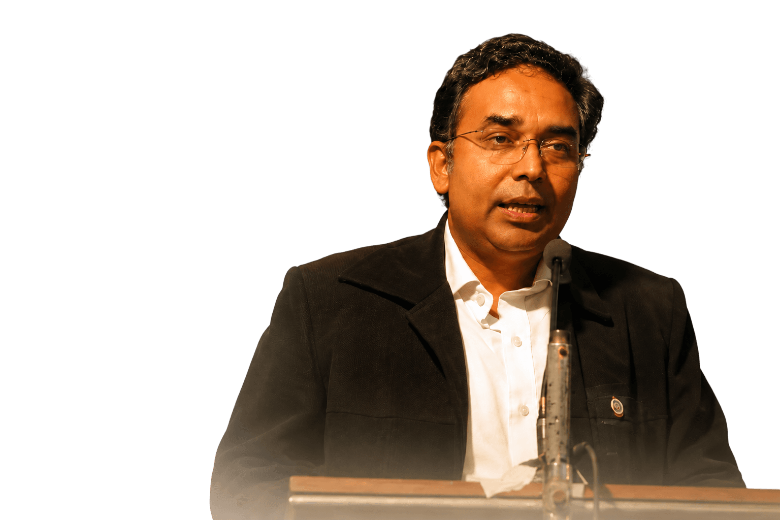 Dr. Sanjay Goel speaking at a lectern.